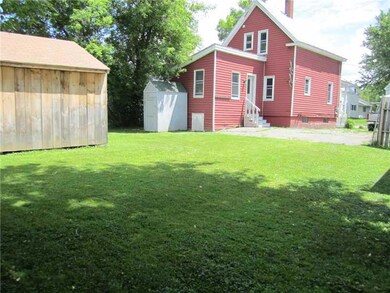 Exterior Back. with view of storage shed