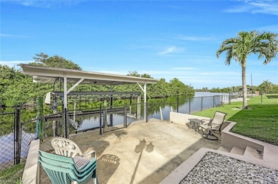 View of dock and lift featuring a water view