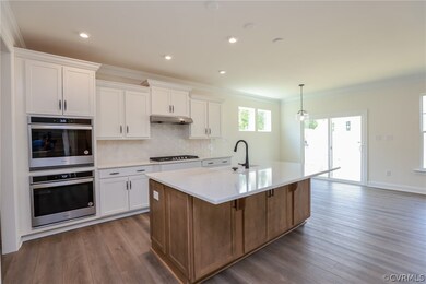 DESIGNER KITCHEN with large QUARTZ ISLAND with bre