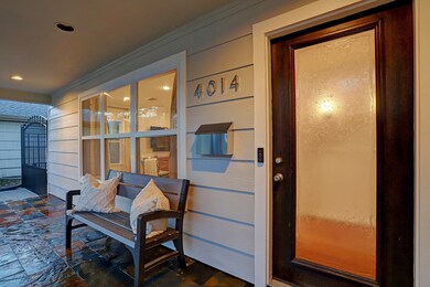 To the left of the porch, a long gated driveway ad