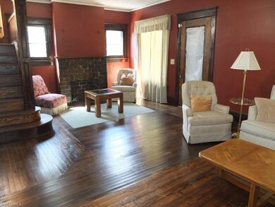 Living room with hardwood flooring, fireplace and 