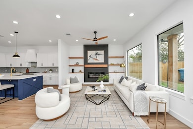 Abundant natural light pours
through windows, cre