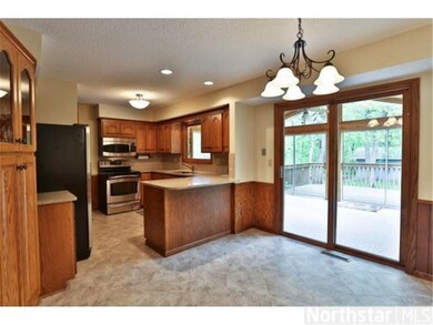 Kitchen and informal dining room opens up to a 3 s