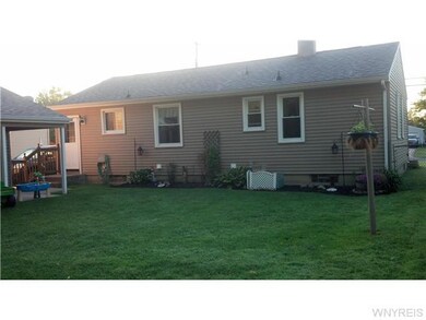 Exterior Back fully fenced yard with covered patio