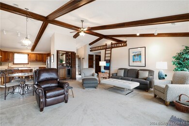 Living room showing ladder to loft