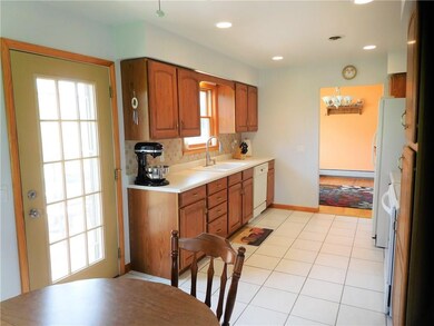Recessed lighting and ceiling fan in kitchen, view