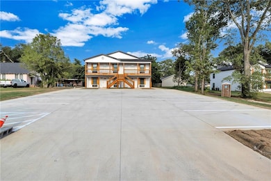 Raised beach house featuring stairs