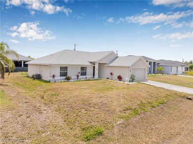 Single story home with concrete driveway, a garage
