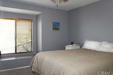 Master bedroom with ceiling fan.