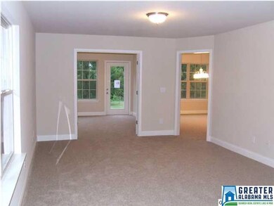 Living room looking into the sun room on the left 