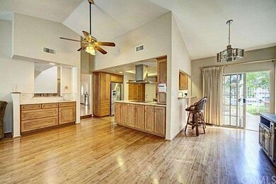 Kitchen from the great room showing the wet bar an