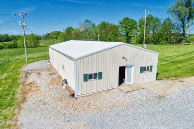 60x30 out-building both heated and cooled. Includes an office and kitchen area and half bath.