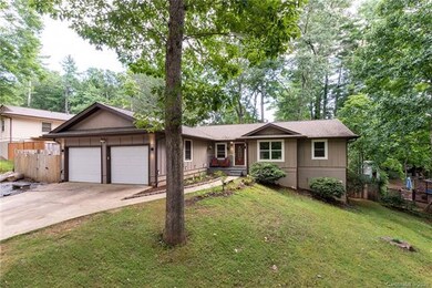 Neighborhood features lovely tall oak trees like t