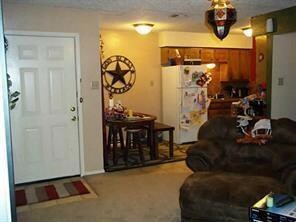 Front door, dining & kitchen areas.