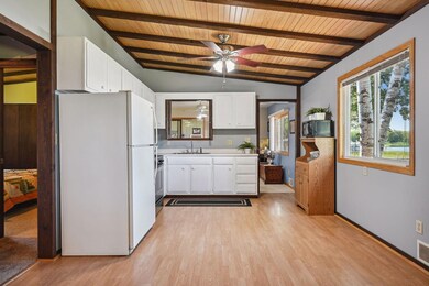The beautiful white kitchen adds a refreshing statement to the home.