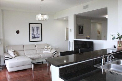 Living area with dark wood-type flooring