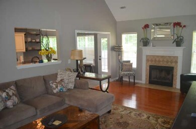 The living room of this home is a main focal point - this is a spacious room with hardwood flooring and a fireplace.  