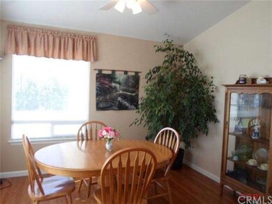 Sunny kitchen nook with two large picture windows 