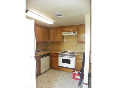 Kitchen featuring light tile patterned flooring, w