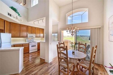 Relax in the eating area near the kitchen with you