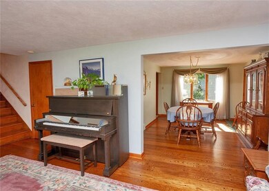 The living room opens to the dining room where the