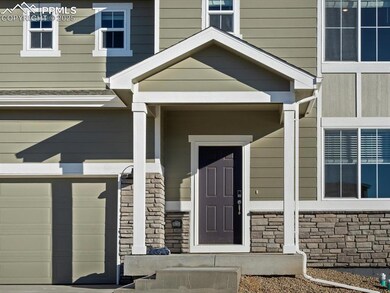 Entrance to property with a garage