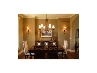 Elegant Dining Room with chandelier, sconces & buf
