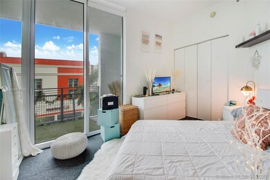 guest bedroom with balcony views and access