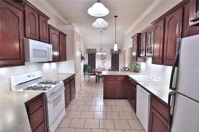 Gas stove, Cherry cabinets.