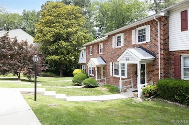 Townhome / multi-family property featuring brick s