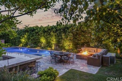 Dramatic pool and patio with fire pit.