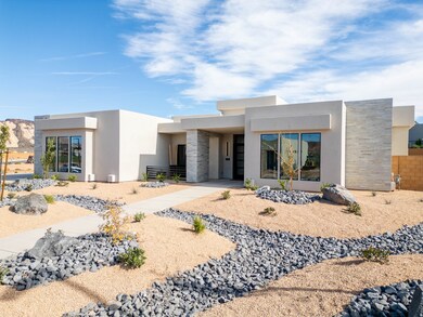 Contemporary home featuring stone siding and stucco siding