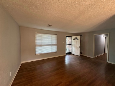 Entrance foyer with dark wood finished floors, vis