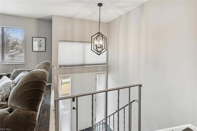 MODERN CHANDLIER AND FRESH PAINT COLORS THROUGHOUT