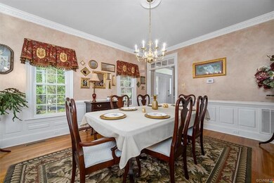 Spacious Dining Room with Picture Frame Wainscotin