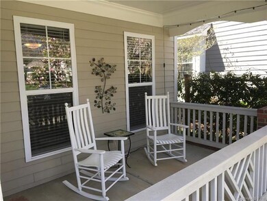 Rocking chair front porch with jasmine trellis