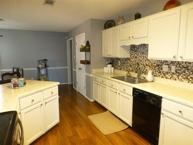 Another view of the kitchen showing beautiful floo