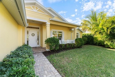 Entrance to property with a lawn