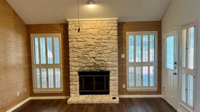 Unfurnished living room with lofted ceiling, wood