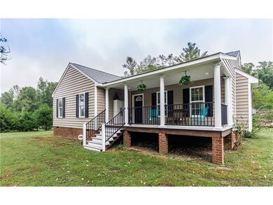 Covered front porch, gutters, vinyl siding
