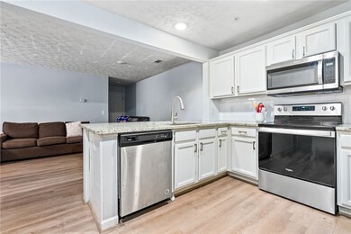 Kitchen open to great room with eat-at bar counter