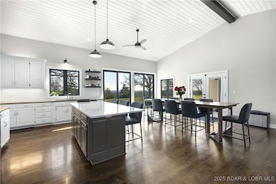 Open concept living, kitchen, & dining areas
