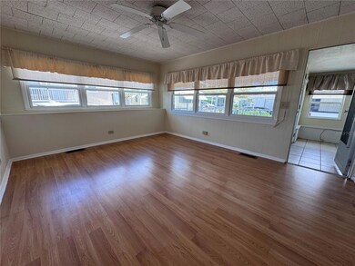 Living room with laminate flooring.