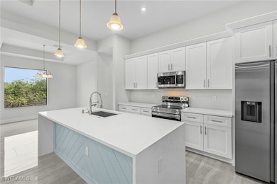 Kitchen with appliances with stainless steel finis