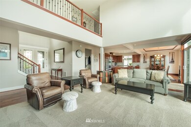 Sunny spacious great room with wall of windows to the mountain and territorial views.