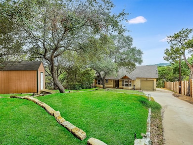 View of front of home with concrete driveway, a s