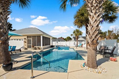 View of pool featuring a sunroom and a patio area