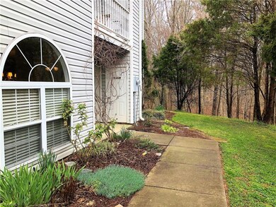 Rear entrance that faces private, wooded area.
