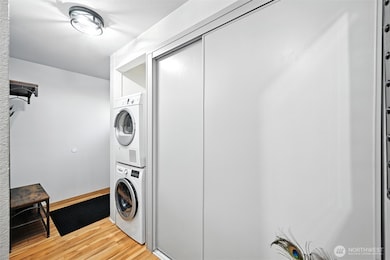 Entry into small welcome area.  Private laundry in unit.  Hall leads to primary bedroom and on to main living area. Great storage space in entry hall.