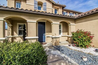 Front entry is hardscape beautifully, covered entr